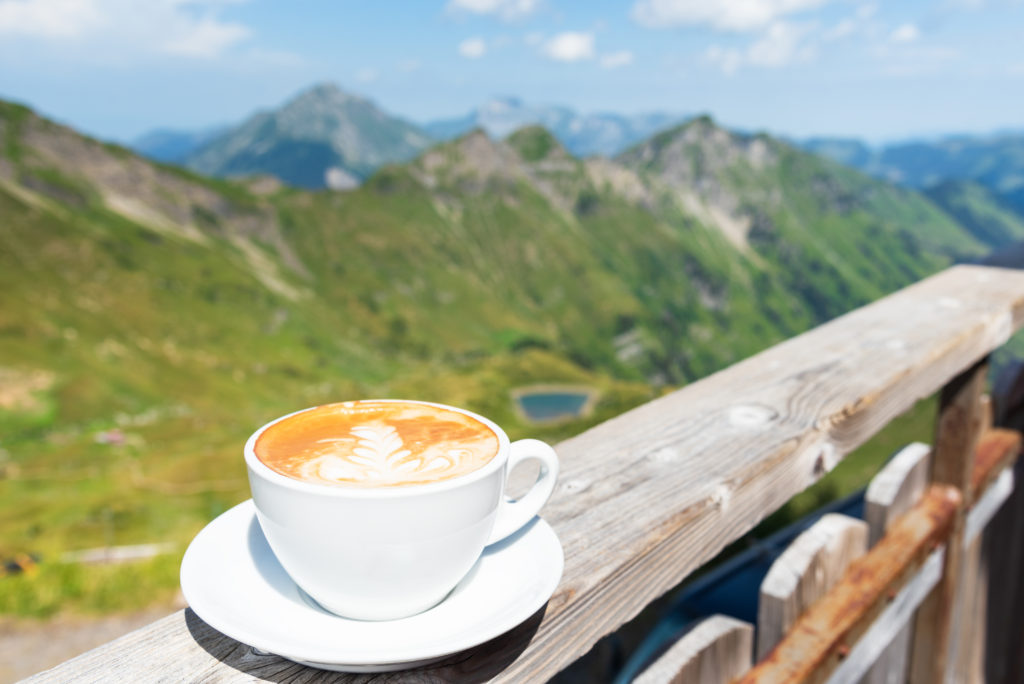 Cup,Of,Hot,Coffee,On,Terrace,With,Beautiful,View,Of